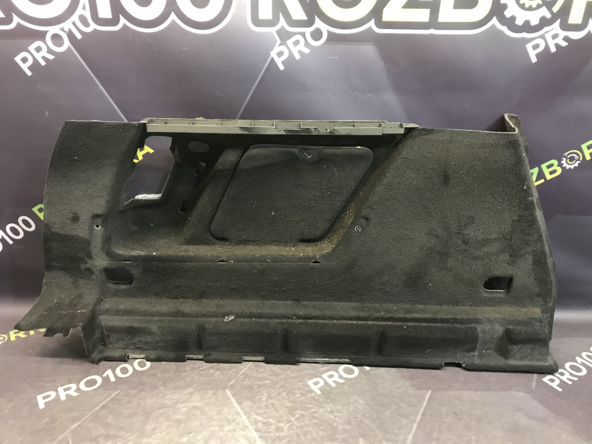 Обшивка багажника ліва універсал Opel Astra J (09-15)